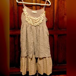 Romantic a’’reve gauze like eyelet detailed edge of dress.